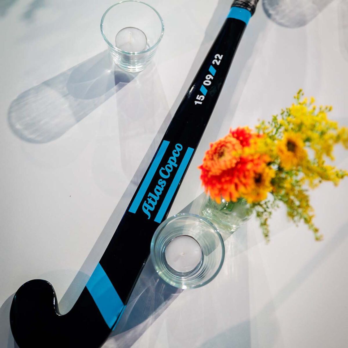 Atlas Copco Evolve to stay ahead bedrukte hockey stick