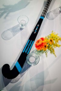 Atlas Copco Evolve to stay ahead bedrukte hockey stick